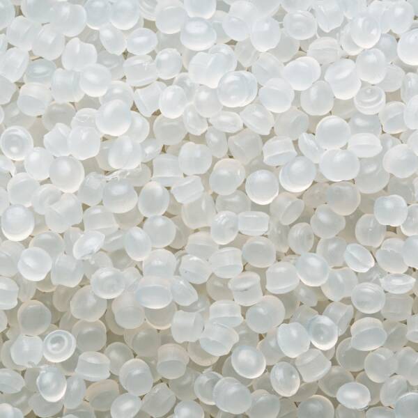 Translucent polymer pellets form clean texture, raw medical grade material for molding labware, pipettes, syringes, tubing.